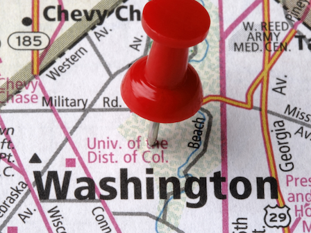 The image shows a map with a red pushpin marking the location of Washington, D.C., including nearby streets and landmarks.